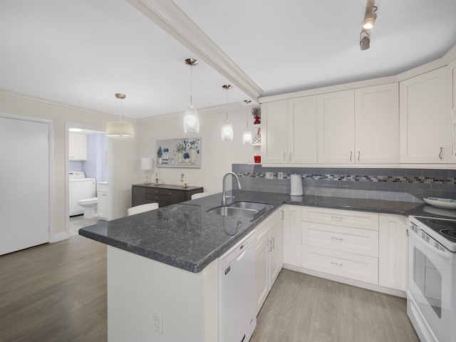 kitchen with white cabinetry, washer / clothes dryer, white appliances, and sink