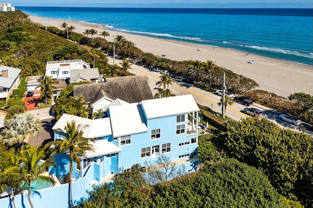 bird's eye view featuring a water view and a beach view