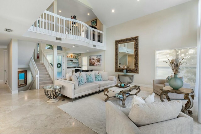 living room with a high ceiling