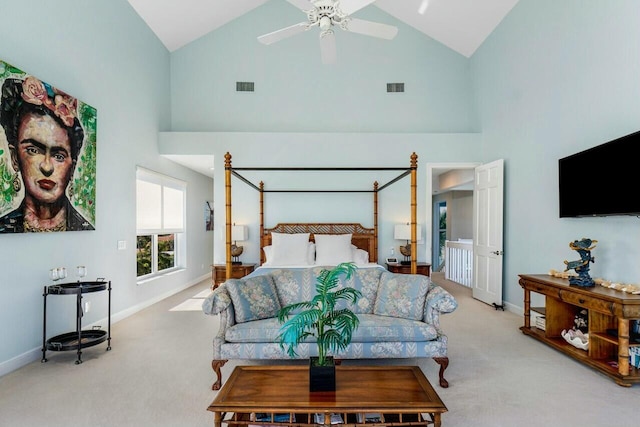 carpeted bedroom with high vaulted ceiling