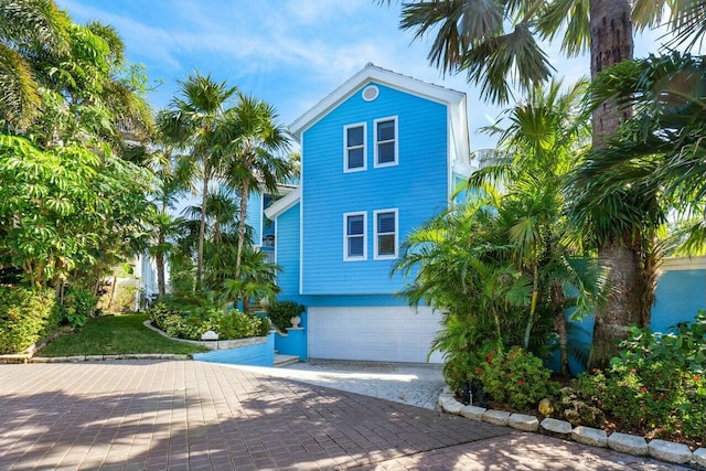 coastal home with a garage