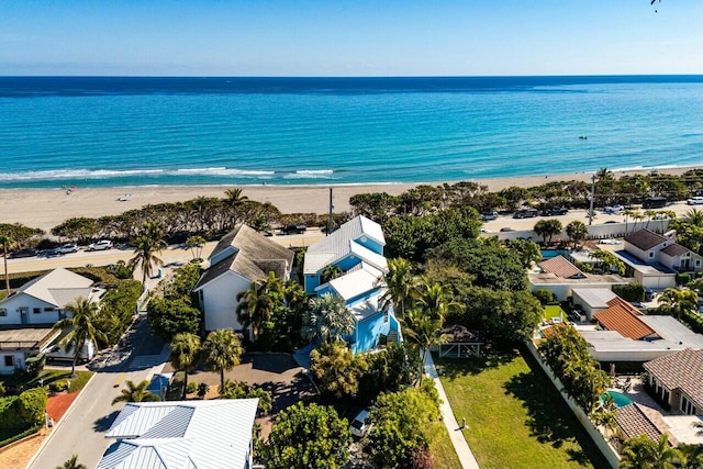 aerial view featuring a water view and a beach view