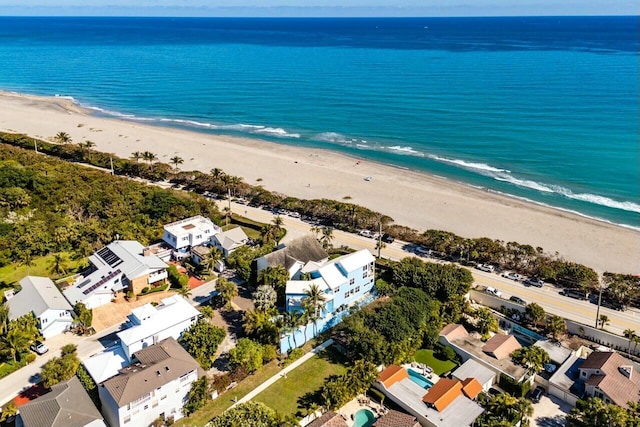 aerial view featuring a water view and a beach view