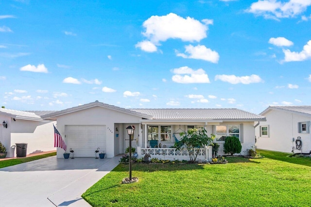 ranch-style house featuring a garage and a front yard