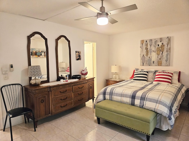 tiled bedroom with ceiling fan