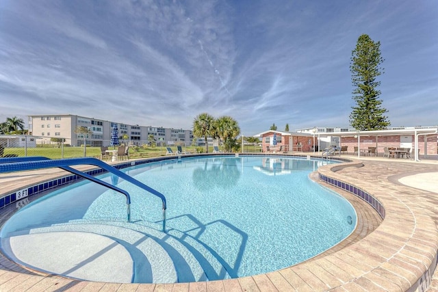 304 Wellington F, West Palm Beach, FL 33417 - community pool featuring a patio