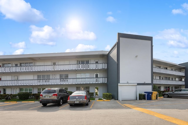 304 Wellington F, West Palm Beach, FL 33417 - view of apartment building / complex featuring uncovered parking