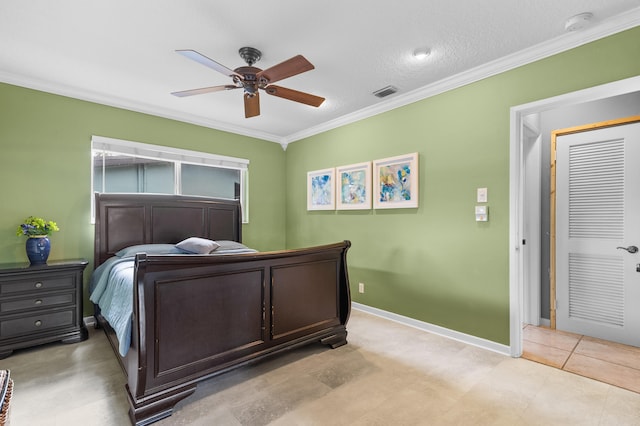 bedroom with ceiling fan, ornamental molding, and light tile patterned flooring