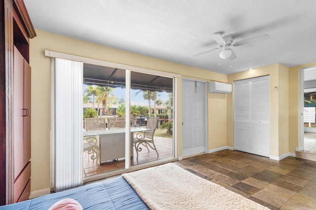 unfurnished bedroom featuring a wall mounted AC, access to exterior, and ceiling fan