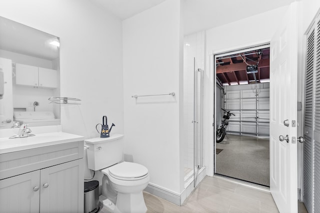 bathroom featuring vanity, an enclosed shower, and toilet