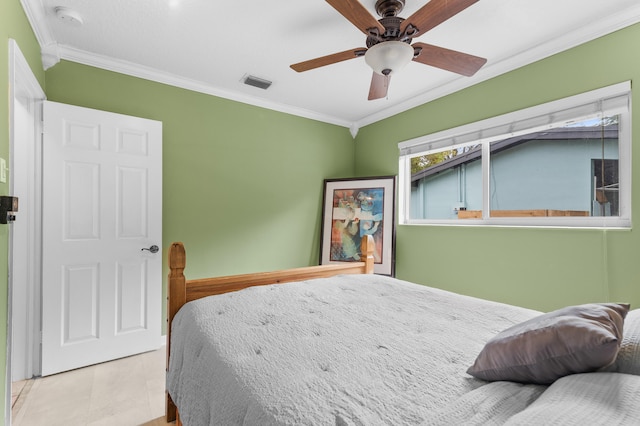 bedroom with ornamental molding, light tile patterned floors, and ceiling fan