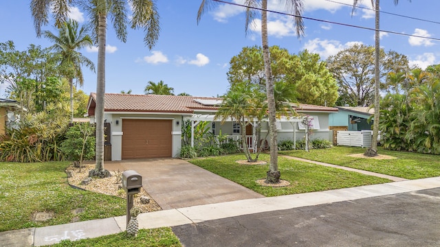 view of front facade featuring a garage and a front yard