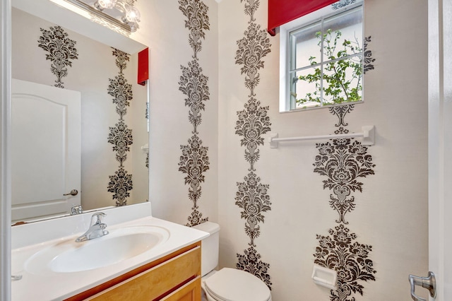 bathroom with vanity and toilet