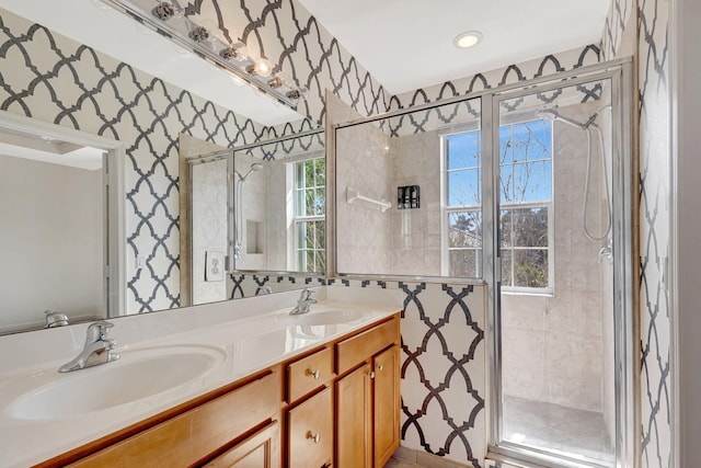 bathroom featuring vanity and a shower with shower door