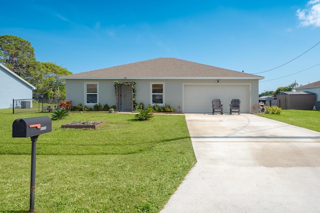 ranch-style house featuring a garage and a front yard