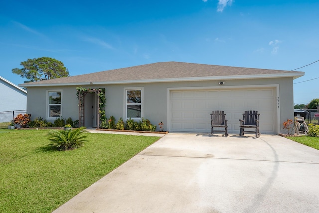 ranch-style home featuring a garage and a front lawn