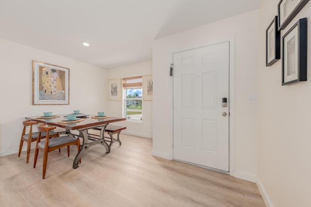 dining space with light wood-type flooring