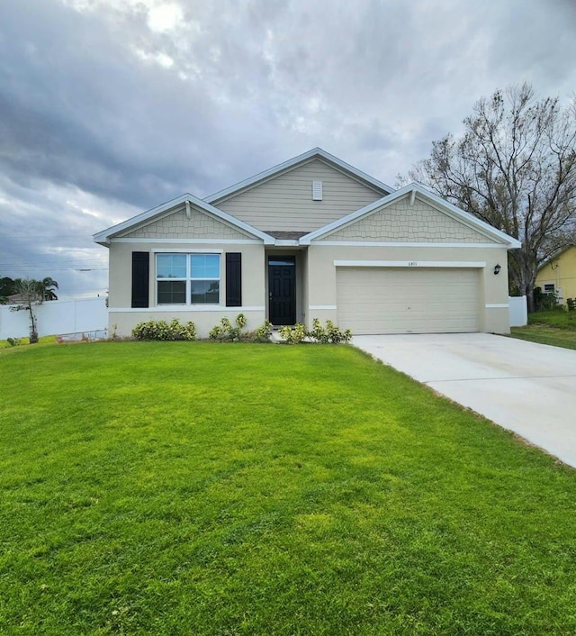 ranch-style home featuring a garage and a front yard