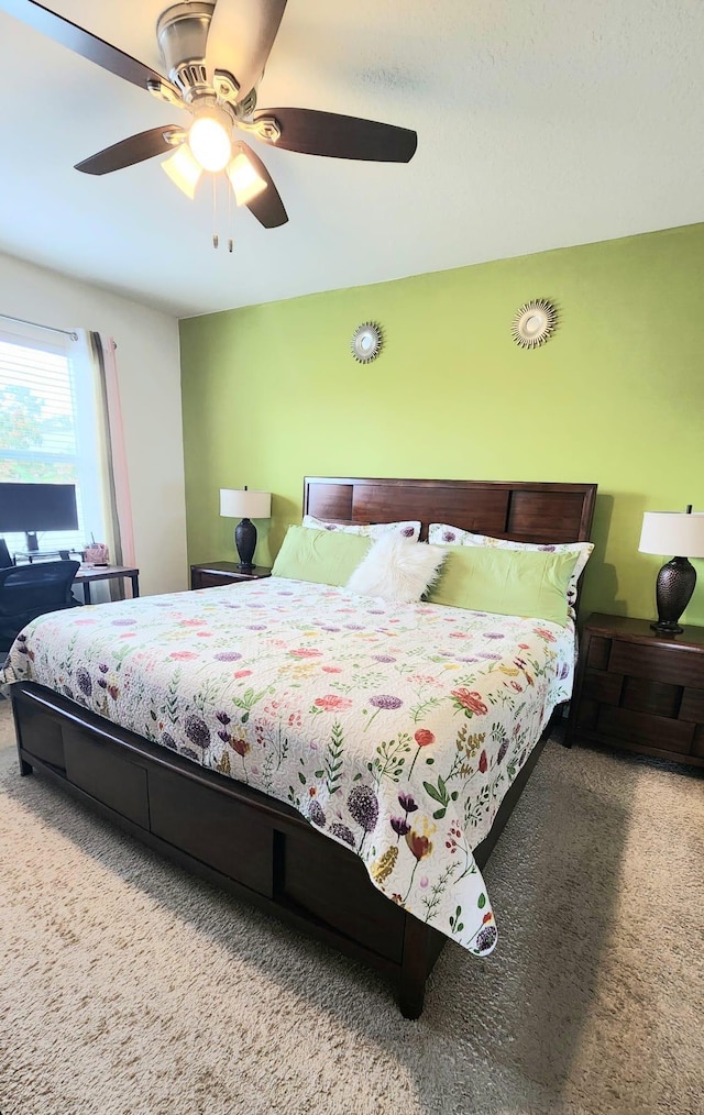 carpeted bedroom with ceiling fan