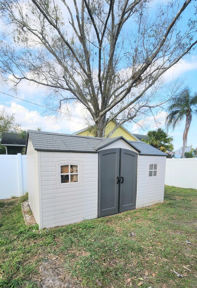 view of outdoor structure with a lawn