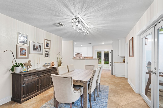812 NW 26th St, Wilton Manors, FL 33311 - dining space featuring french doors, light tile patterned floors, and baseboards