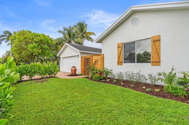 812 NW 26th St, Wilton Manors, FL 33311 - view of side of property featuring stucco siding, an outbuilding, and a detached garage