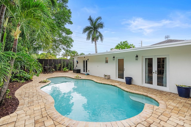 812 NW 26th St, Wilton Manors, FL 33311 - view of swimming pool with french doors, a patio, and a fenced backyard