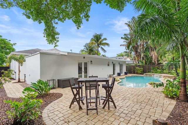 812 NW 26th St, Wilton Manors, FL 33311 - view of swimming pool with french doors, a fenced backyard, and a patio