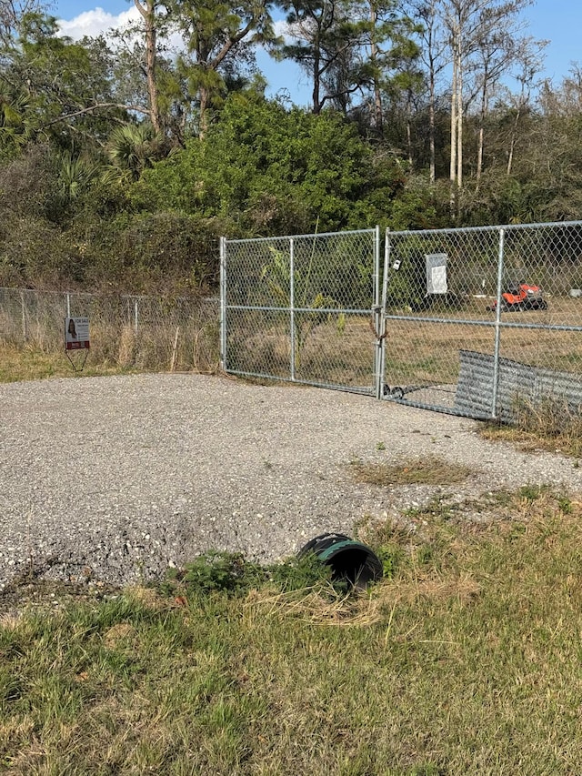 view of gate with fence