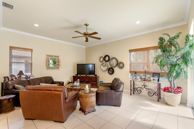 living room with ceiling fan, ornamental molding, visible vents, and a healthy amount of sunlight