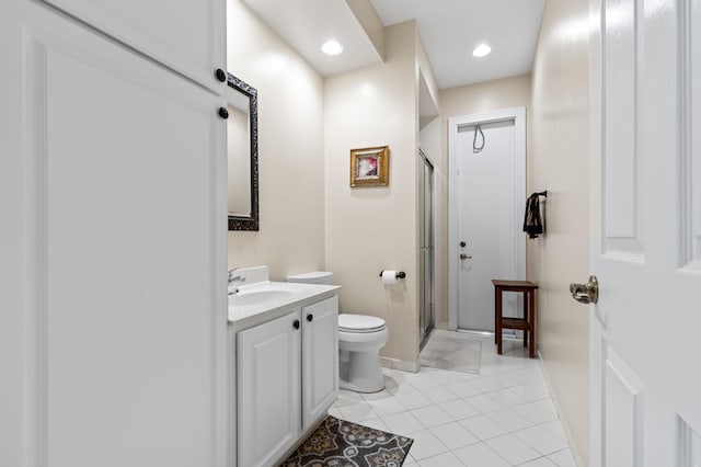 full bath featuring a stall shower, toilet, tile patterned floors, vanity, and recessed lighting