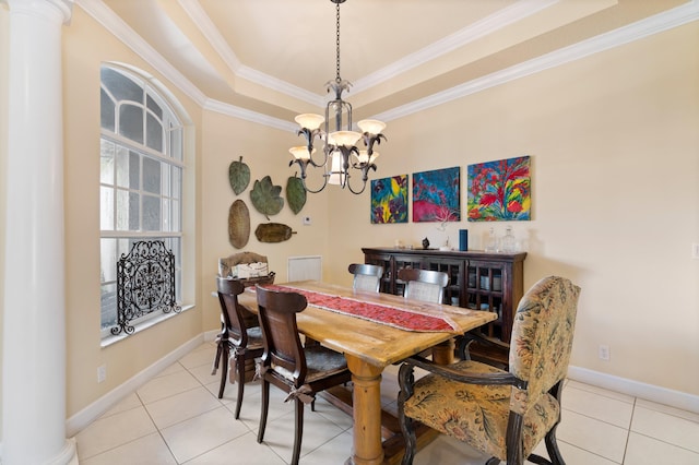 dining room with light tile patterned floors, a chandelier, baseboards, ornamental molding, and a raised ceiling