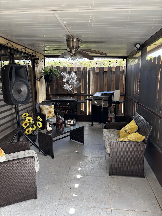 view of patio / terrace featuring ceiling fan, area for grilling, and a fenced backyard