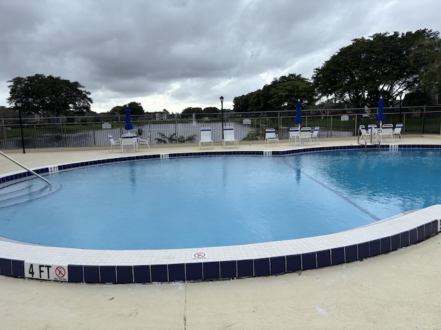 pool featuring fence