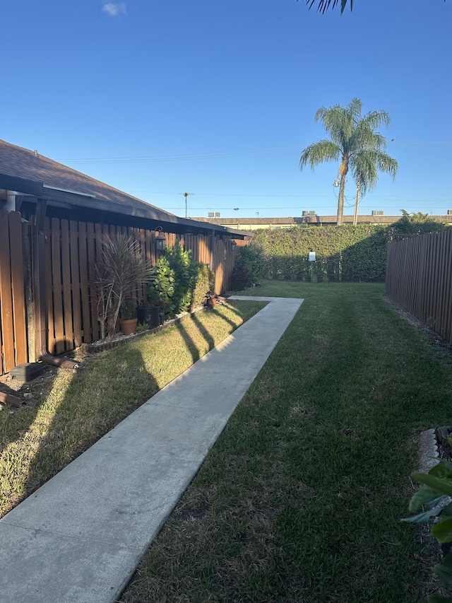 view of yard with a fenced backyard