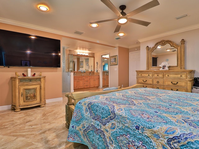 bedroom featuring ceiling fan, ensuite bath, and ornamental molding