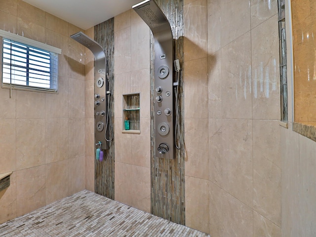 bathroom with tiled shower