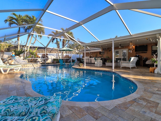 view of pool featuring french doors, a lanai, ceiling fan, and a patio area