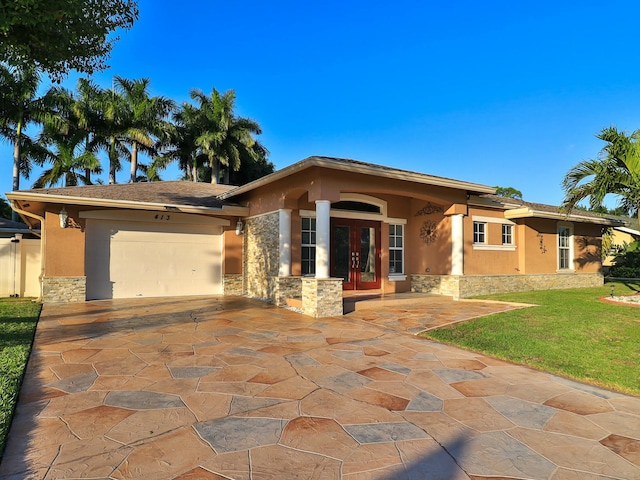 view of front facade featuring a garage and french doors