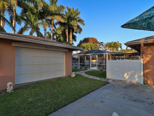 view of yard with glass enclosure