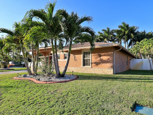 view of property exterior with a yard