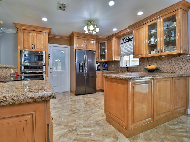 kitchen featuring tasteful backsplash, ornamental molding, stone counters, and appliances with stainless steel finishes