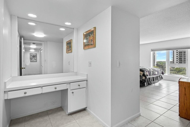 bathroom with vanity and tile patterned floors