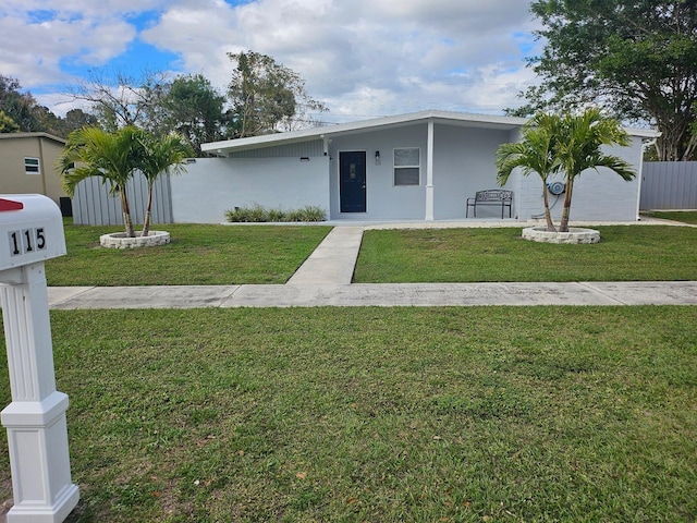 ranch-style house with a front lawn