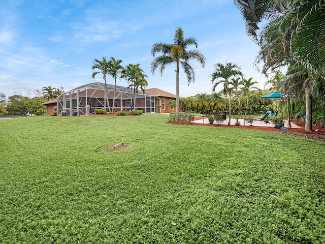 view of yard featuring a lanai