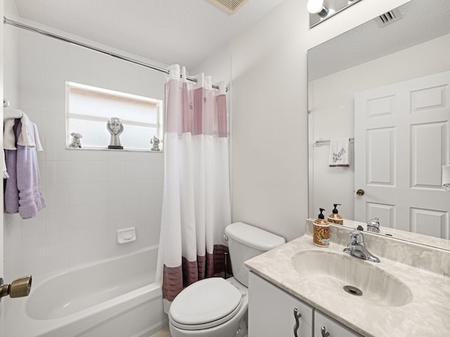 full bathroom with vanity, shower / tub combo, a textured ceiling, and toilet