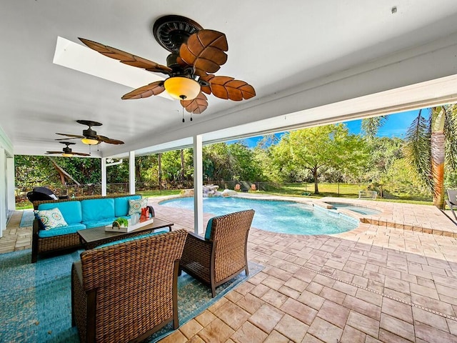 view of swimming pool with an in ground hot tub, an outdoor hangout area, and a patio area