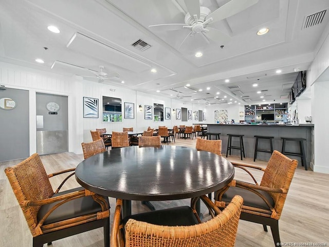 dining area featuring ceiling fan and light hardwood / wood-style flooring