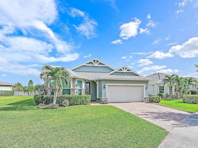 view of front facade with a garage and a front yard