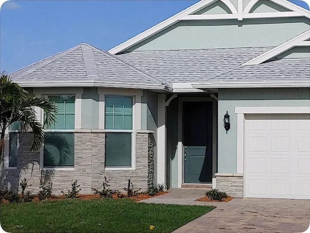 doorway to property with a garage